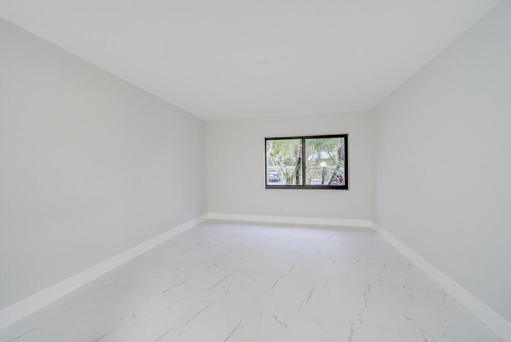 8067 Summerbreeze Lane Boca Raton, FL 33496 - Photo 12 of 29 an empty room with windows