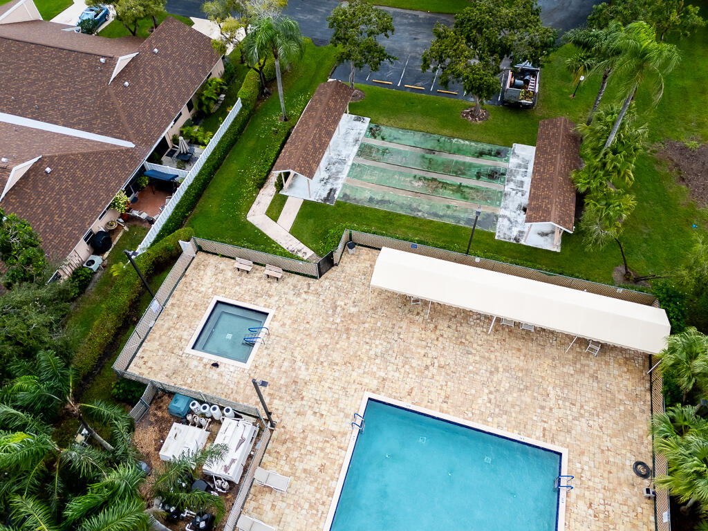 8067 Summerbreeze Lane Boca Raton, FL 33496 - Photo 29 of 29 an aerial view of a house with a yard and a large tree