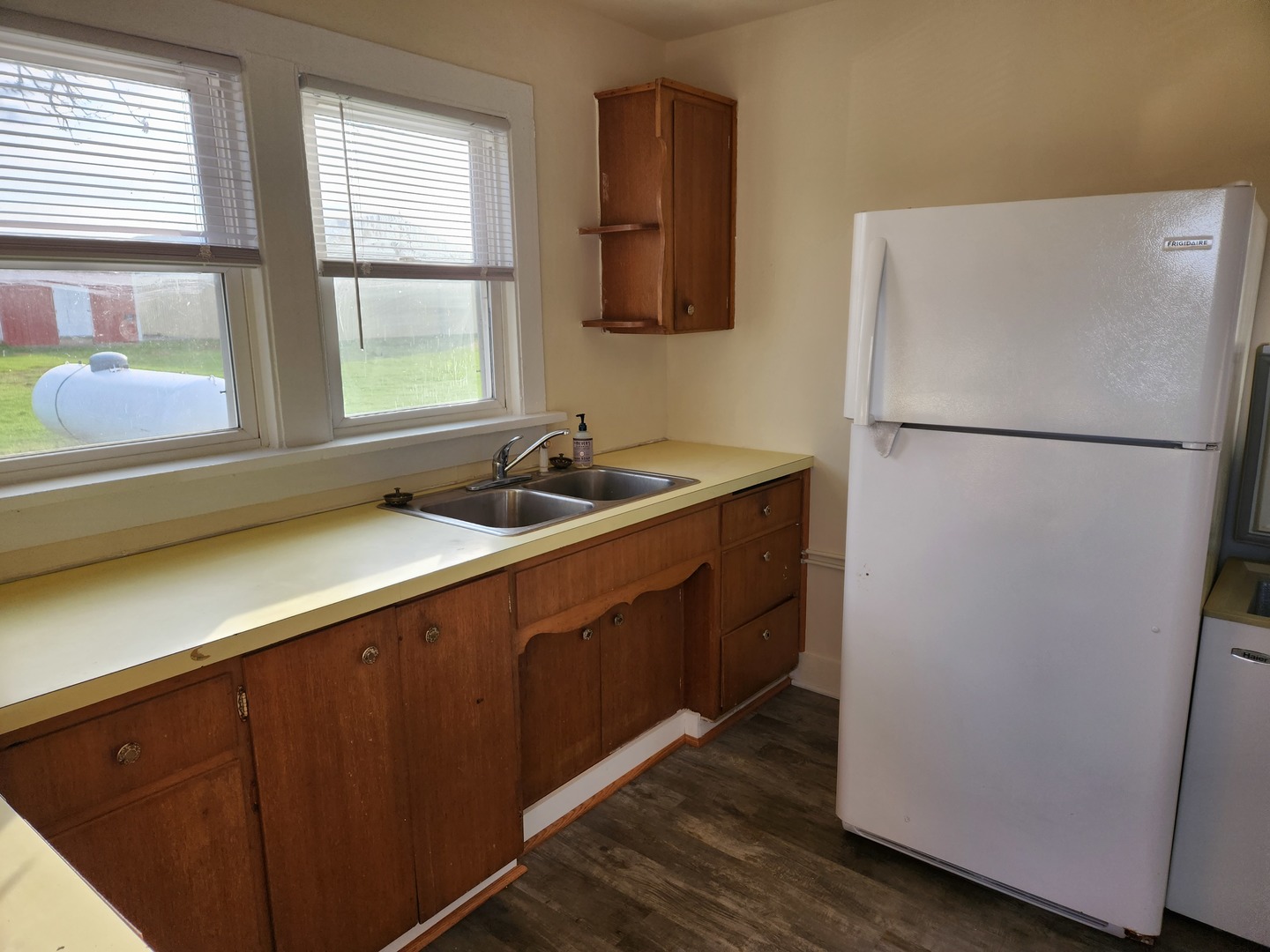 23909 Lawrence Road Harvard, IL 60033 - Photo 12 of 21 a white refrigerator freezer sitting inside of a kitchen