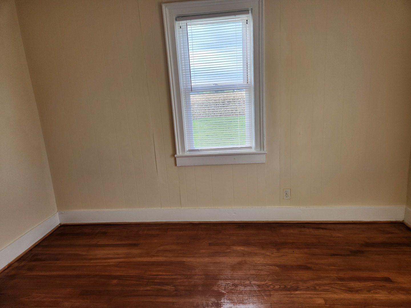 23909 Lawrence Road Harvard, IL 60033 - Photo 13 of 21 a view of an empty room with wooden floor and a window