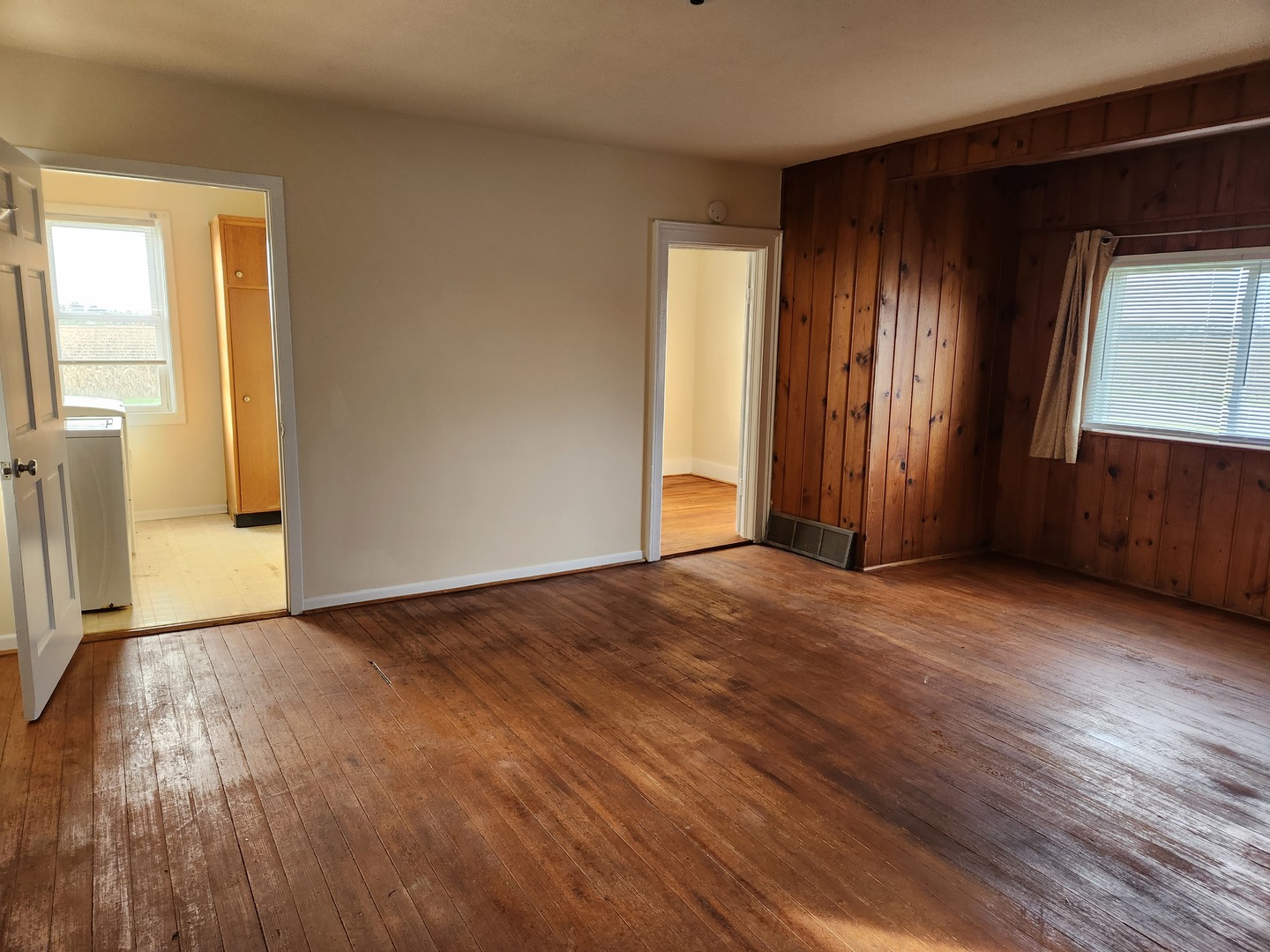 23909 Lawrence Road Harvard, IL 60033 - Photo 15 of 21 a view of an empty room with wooden floor and a window