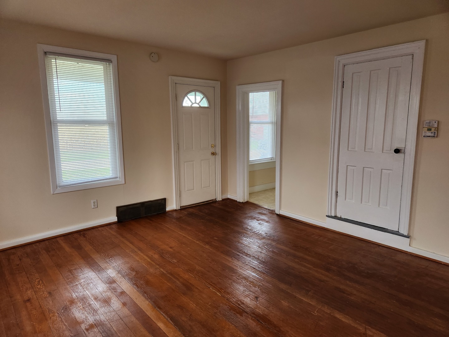 23909 Lawrence Road Harvard, IL 60033 - Photo 18 of 21 an empty room with wooden floor and windows