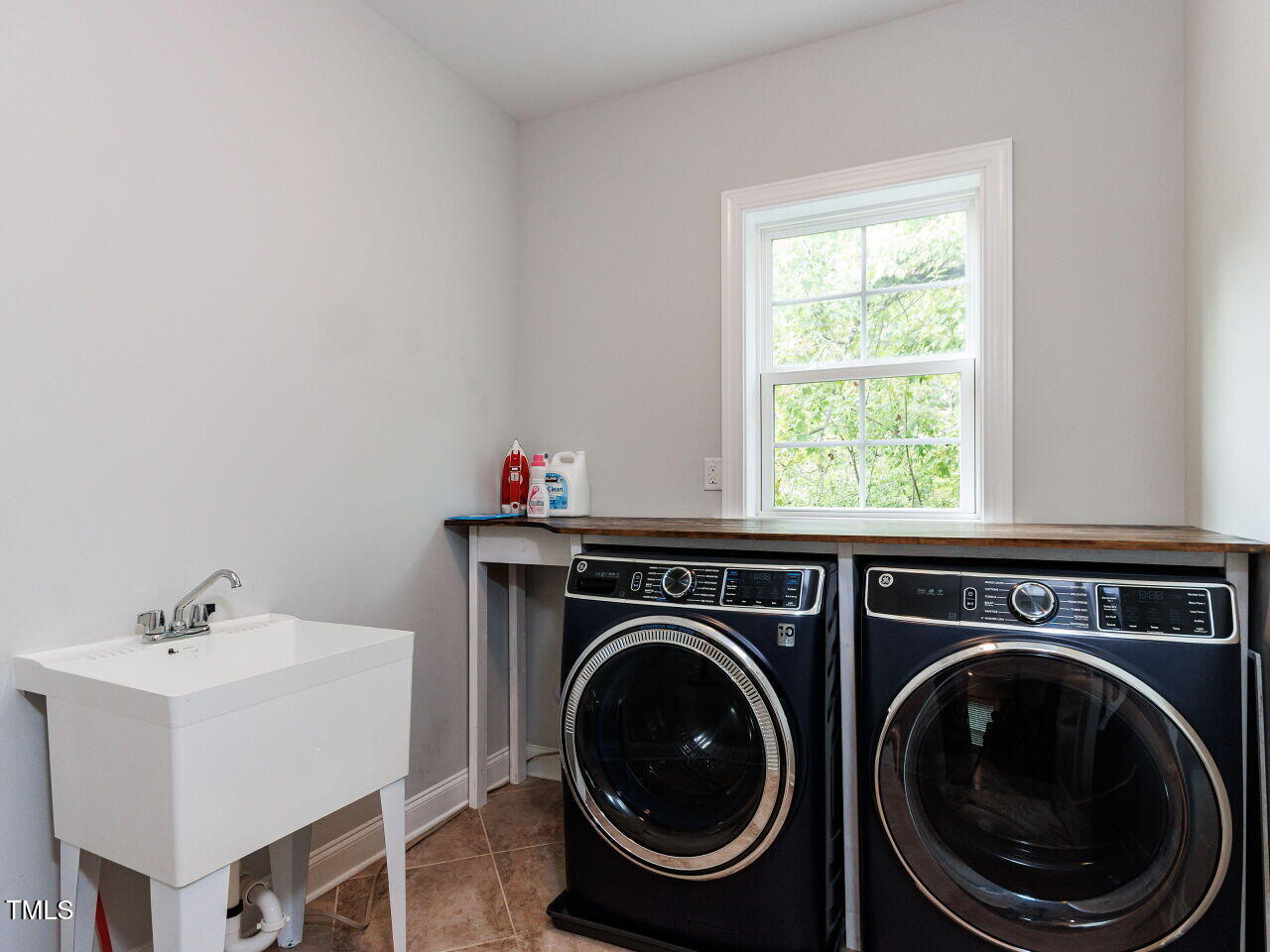 802 Lynn Road Durham, NC 27703 - Photo 28 of 41 Second floor laundry with utility sink