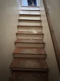 a bedroom with bed and a window