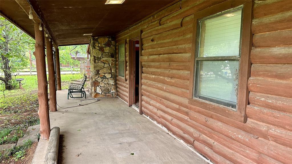 126 Garza Road Shady Shores, TX 76208 - Photo 18 of 19 a view of a door and wooden floor