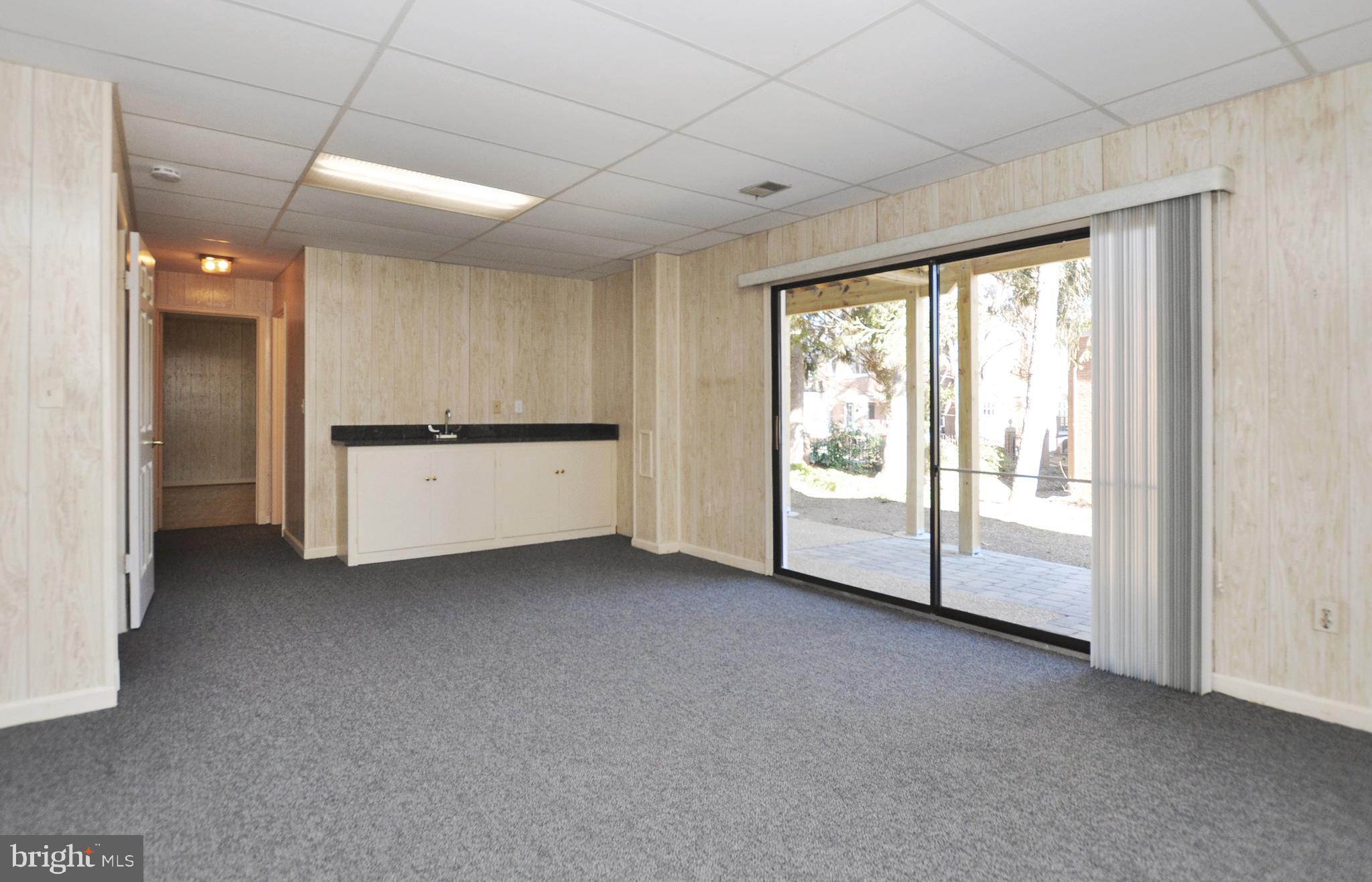5003 Sangamore Road Bethesda, MD 20816 - Photo 25 of 33 Rec room Wet Bar with granite counter