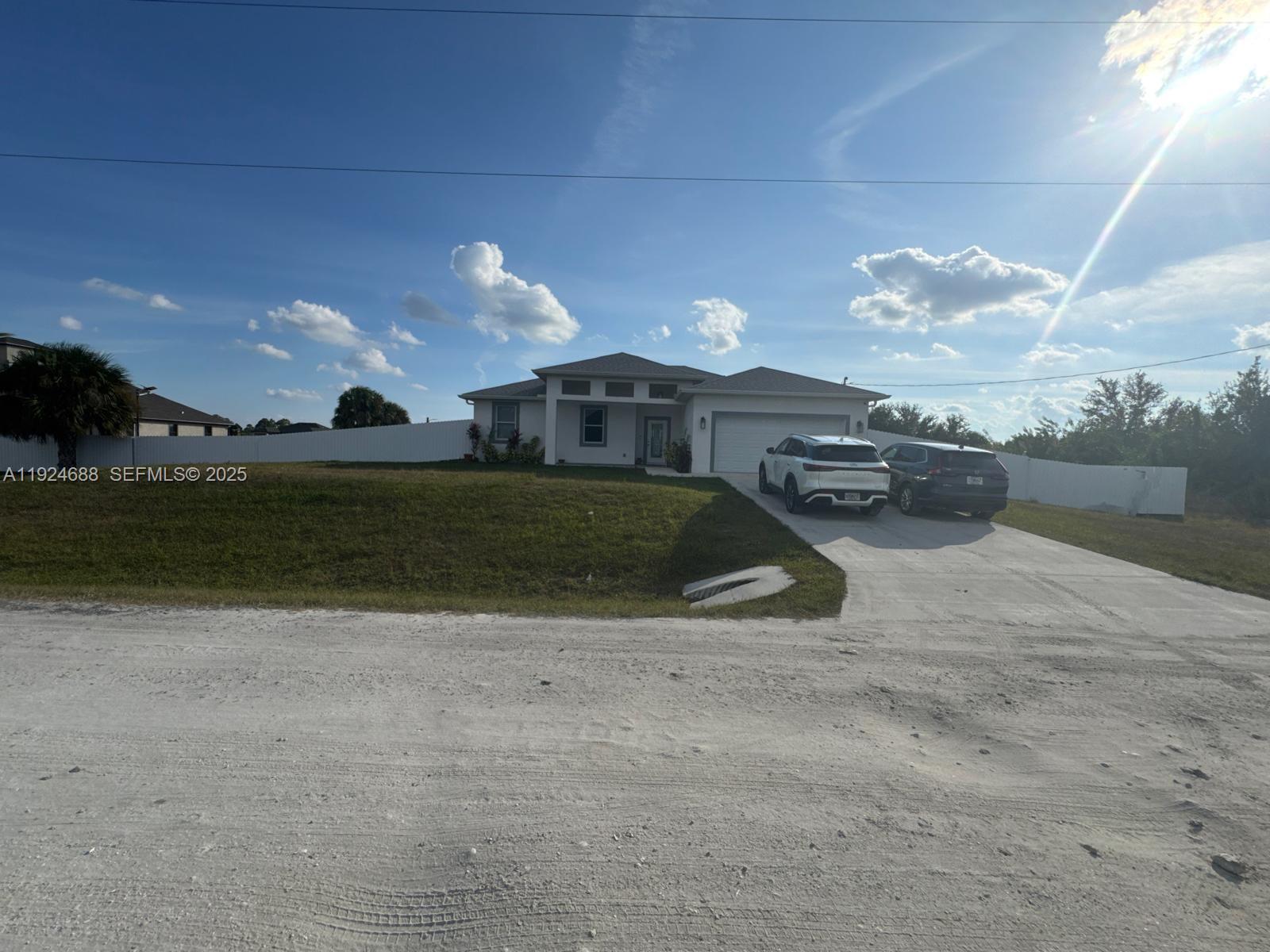 7799 16th Place LaBelle, FL 33935 - Photo 2 of 9 a view of a house with a yard