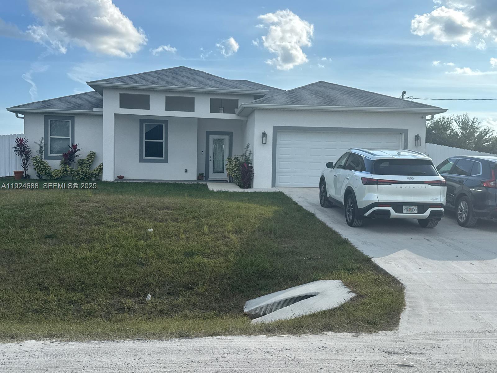 7799 16th Place LaBelle, FL 33935 - Photo 3 of 9 a house view with a garden space