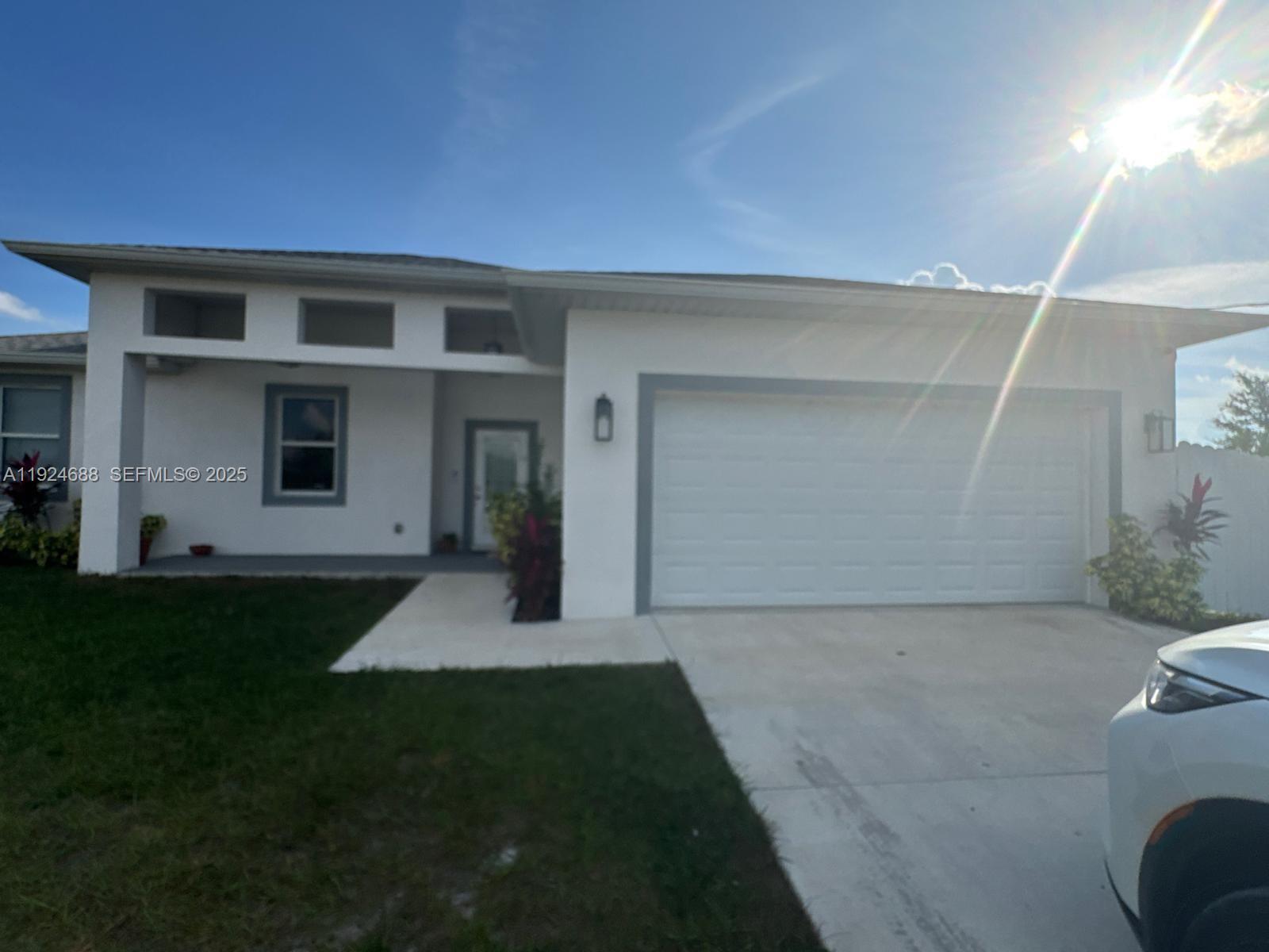 7799 16th Place LaBelle, FL 33935 - Photo 6 of 9 a house view with a garden space