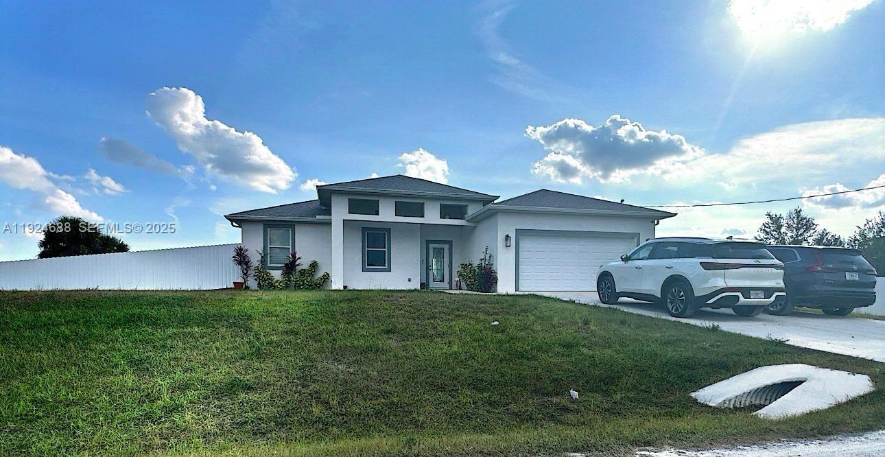 7799 16th Place LaBelle, FL 33935 - Photo 9 of 9 a view of a house with a big yard and potted plants