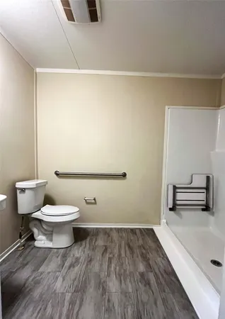 a bathroom with a toilet and a sink