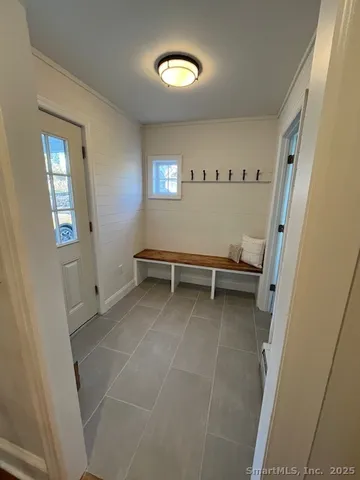 a view of room with stairs and a window