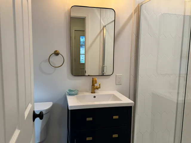 a bathroom with a sink and a mirror