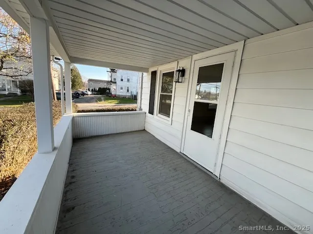 a kitchen with stainless steel appliances kitchen island granite countertop a refrigerator a sink and a stove