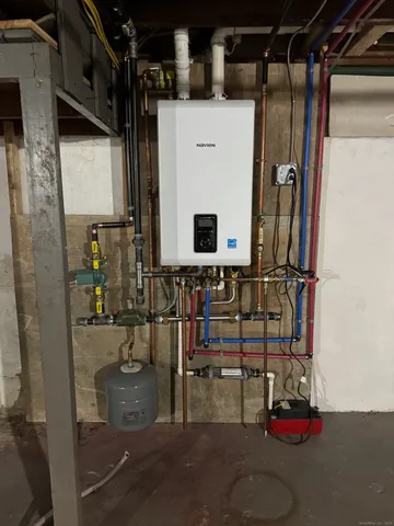 a bathroom with mirror and shower