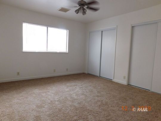 613 Ginger Avenue Ridgecrest, CA 93555 - Photo 9 of 9 an empty room with a window