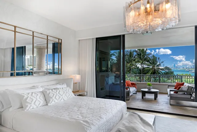 a bathroom with a double vanity sink and mirror with bathtub