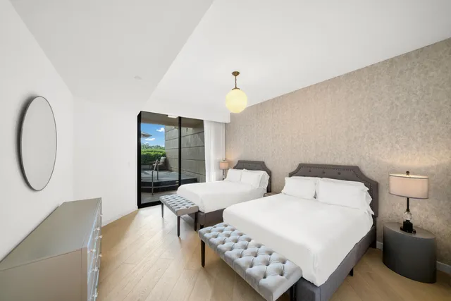 a reading room with furniture and potted plants