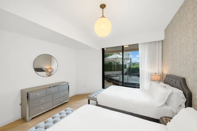 a view of a city with tall buildings and a big yard