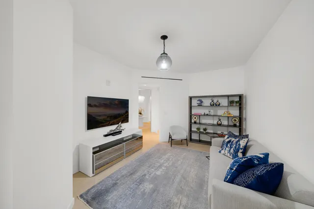 a view of a house with a patio and a garden