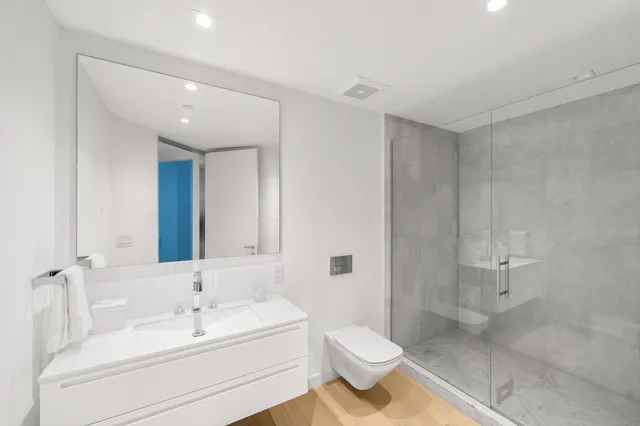 a view of a balcony with a yard