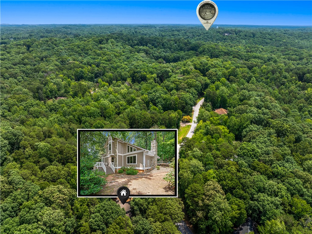 139 Tulip Lane Westminster, SC 29693 - Photo 31 of 37 Perched amidst a verdant landscape, this home offers tranquil forest views and a private, secluded setting.