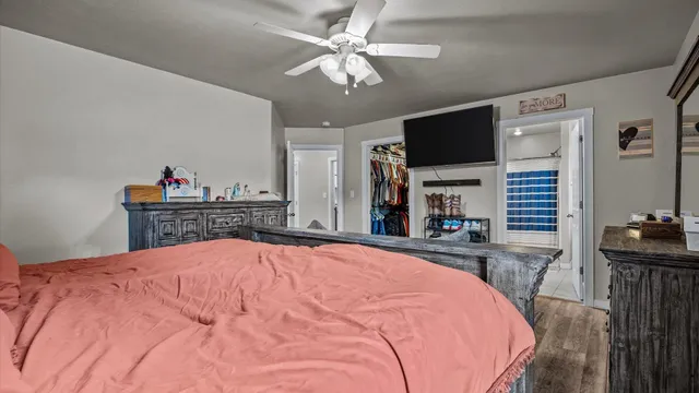 a bed room with a bed and a flat screen tv