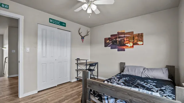 a kitchen with a refrigerator and a stove
