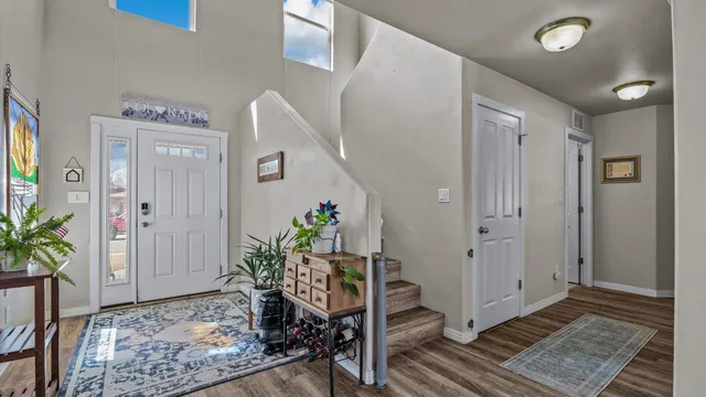 a very nice looking hallway with wooden floor