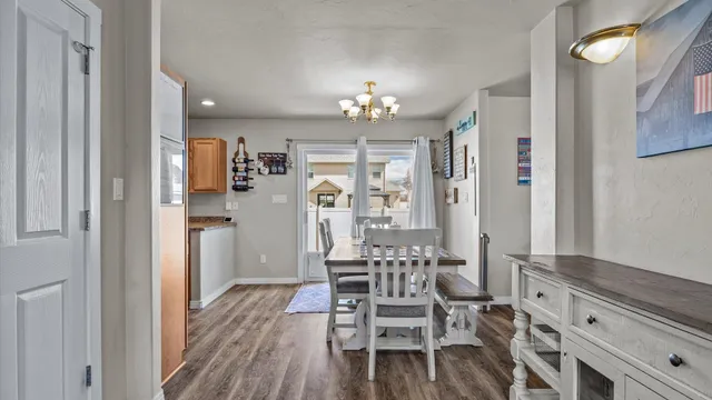 a view of dining room and kitchen with furniture wooden floor and window