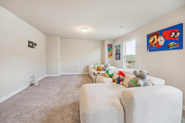 a bedroom with a bed and a book shelf