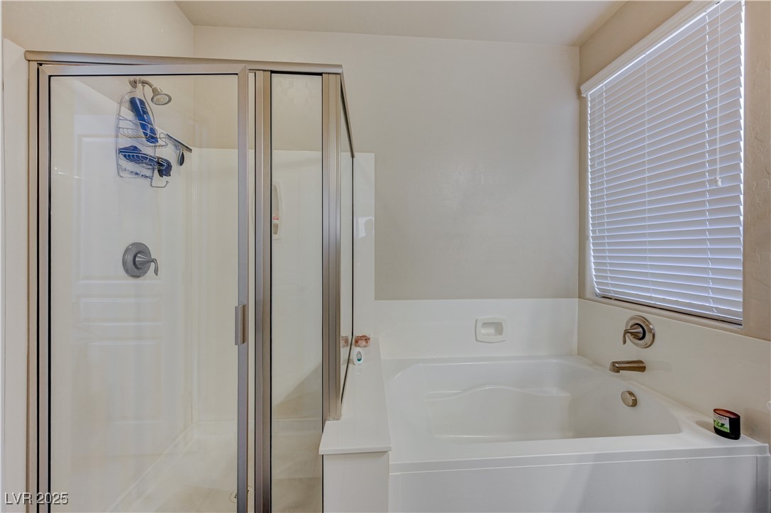 6970 Motley Road Las Vegas, NV 89178 - Photo 25 of 52 Master Bathroom featuring separate shower and a garden tub