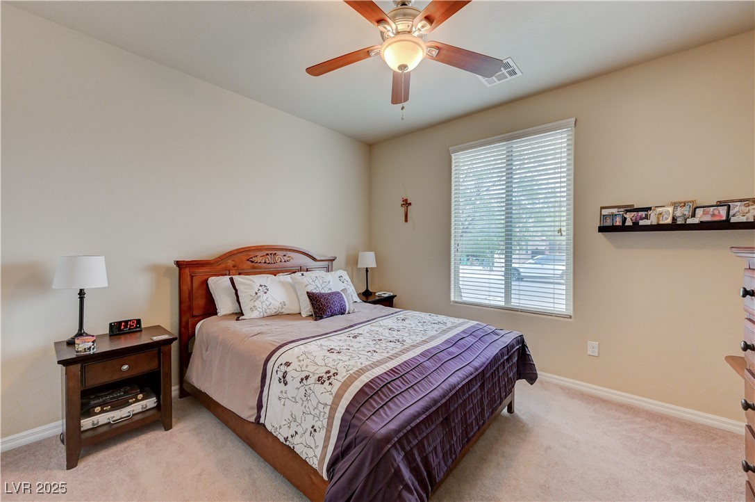 6970 Motley Road Las Vegas, NV 89178 - Photo 42 of 52 Bedroom featuring carpet and ceiling fan