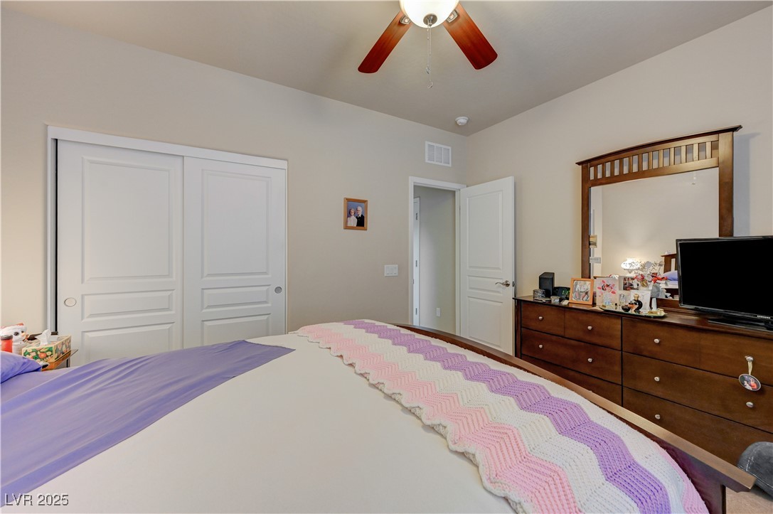6970 Motley Road Las Vegas, NV 89178 - Photo 43 of 52 Bedroom featuring carpet and ceiling fan