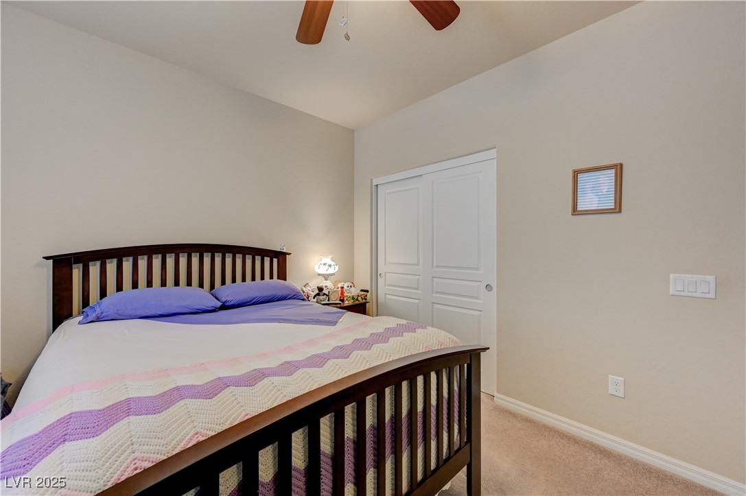 6970 Motley Road Las Vegas, NV 89178 - Photo 44 of 52 Bedroom featuring carpet and ceiling fan
