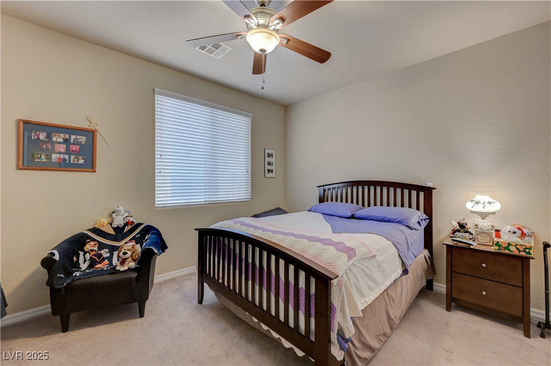 6970 Motley Road Las Vegas, NV 89178 - Photo 46 of 52 Bedroom featuring carpet and ceiling fan