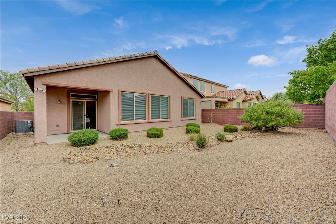 6970 Motley Road Las Vegas, NV 89178 - Photo 51 of 52 Backyard with low-maintenance landscaping and covered patio