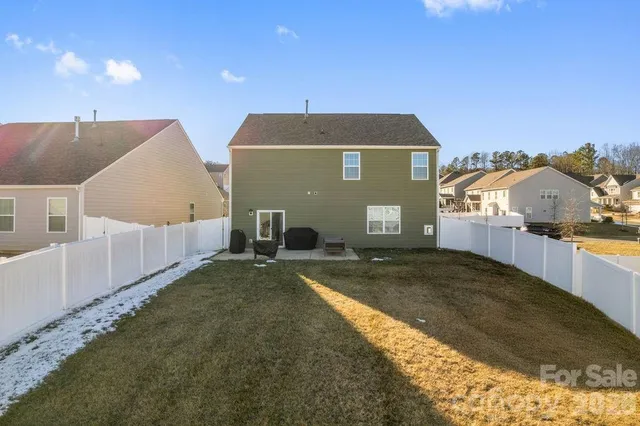 an aerial view of a house with a swimming pool