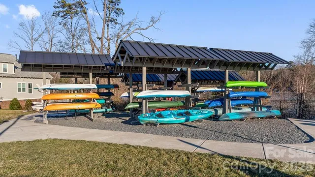 a living room with furniture a rug and a chandelier