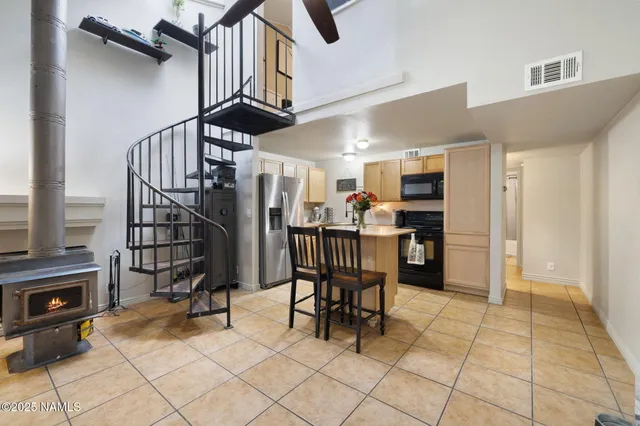 a view of kitchen with furniture and a refrigerator