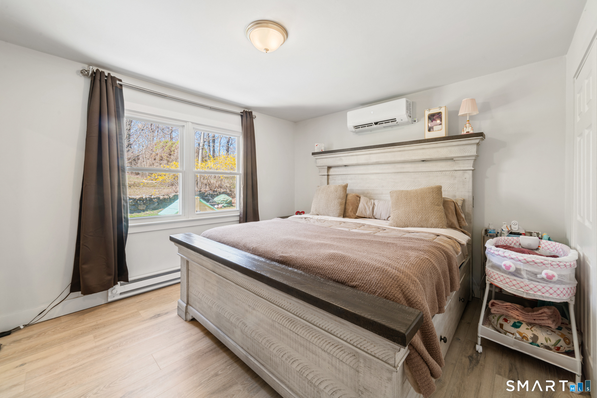 327 Lakeside Boulevard West Waterbury, CT 06708 - Photo 10 of 29 a bedroom with a bed and a window