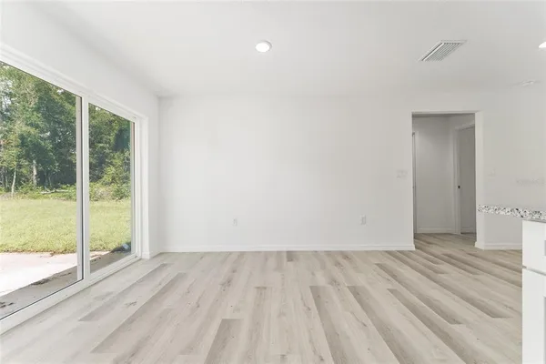 a view of wooden floor and brick walls
