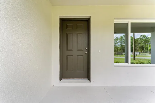 wooden floor and window in an empty room