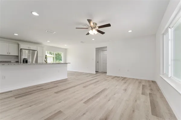 a view of a kitchen with a sink and a window