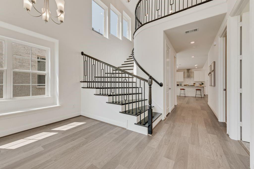 a view of an entryway with wooden floor