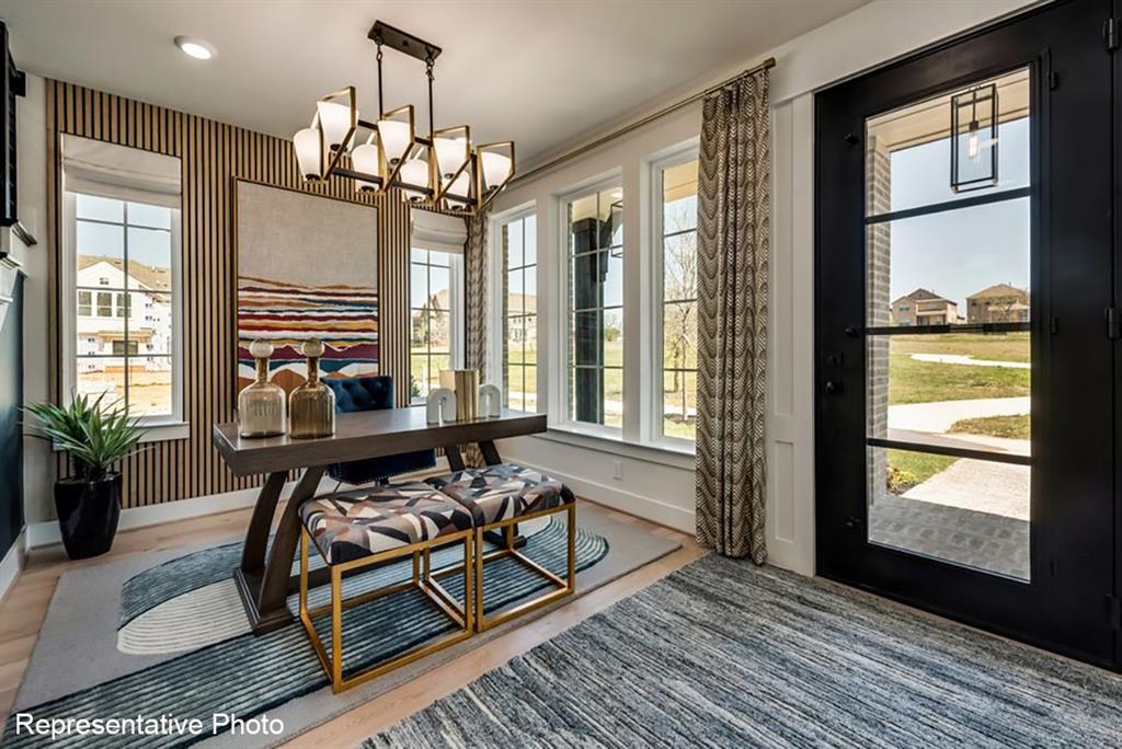 12711 Pne Rdg Trail Wylie, TX 75098 - Photo 4 of 30 a view of a livingroom with furniture and a chandelier
