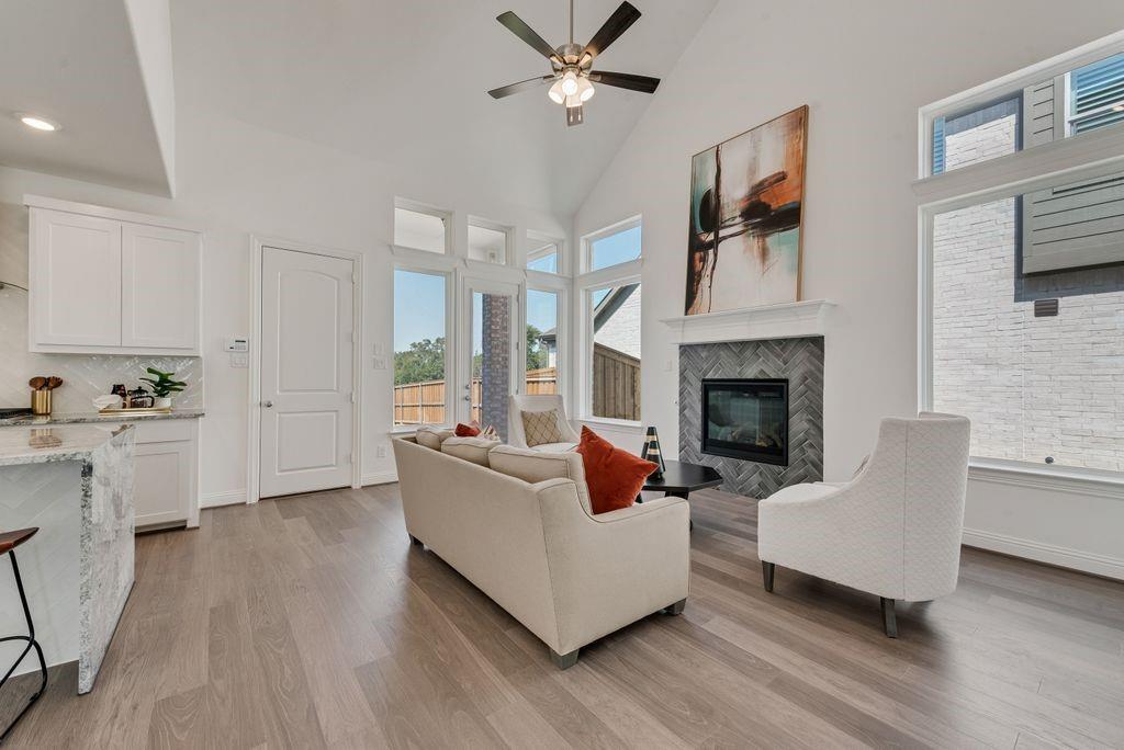 12711 Pne Rdg Trail Wylie, TX 75098 - Photo 5 of 30 a living room with furniture and a fireplace