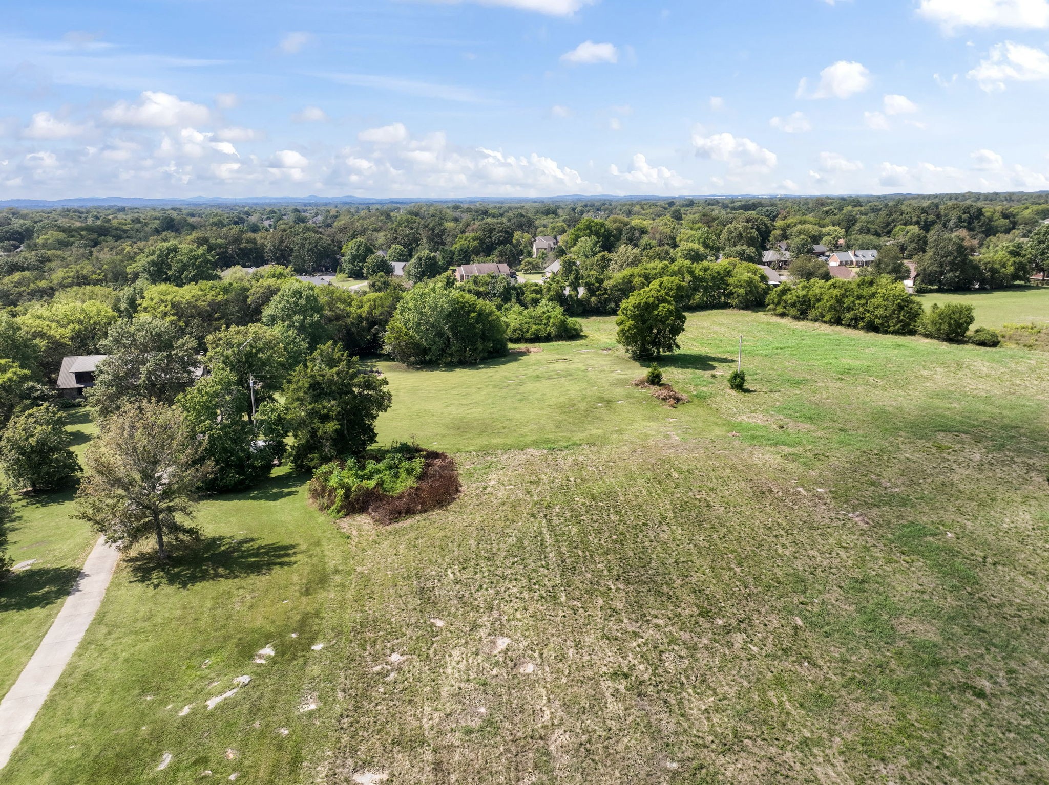 3289 Siegel Road Murfreesboro, TN 37129 - Photo 14 of 14 a view of a garden with a building in the background