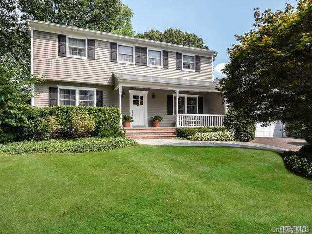 2 Bay Path Court Huntington, NY 11743 - Photo 1 of 1 a front view of a house with a garden