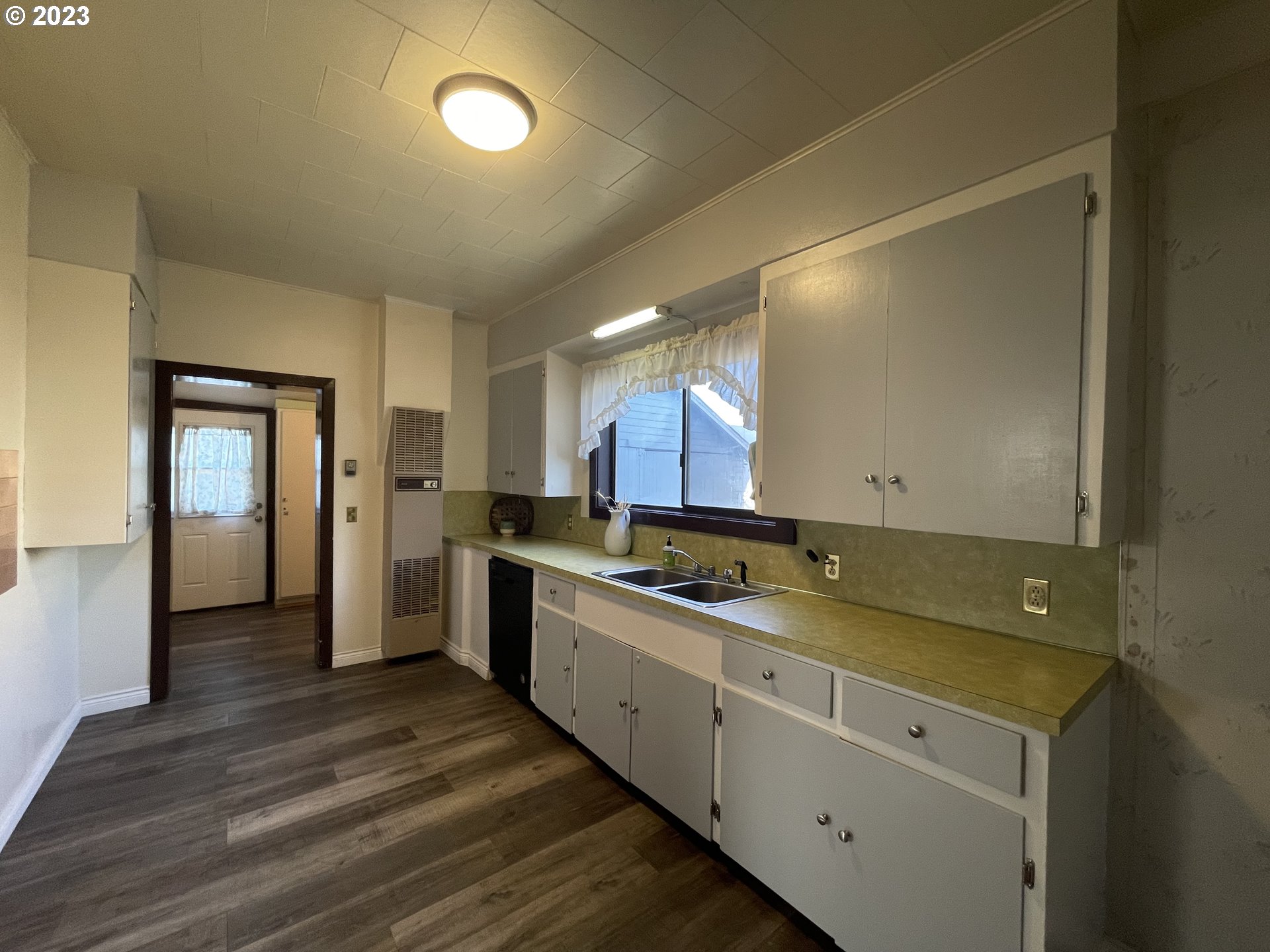 333 Southwest 3rd Street Pendleton, OR 97801 - Photo 8 of 20 a view of a kitchen counter space with wooden floor